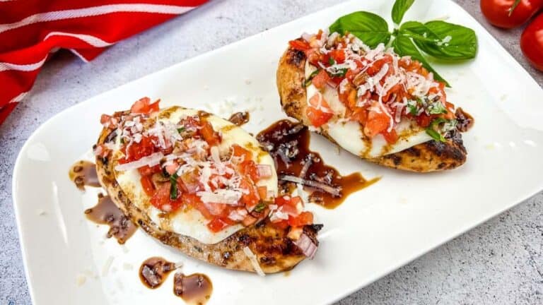 Grilled Bruschetta Chicken on a white plate.