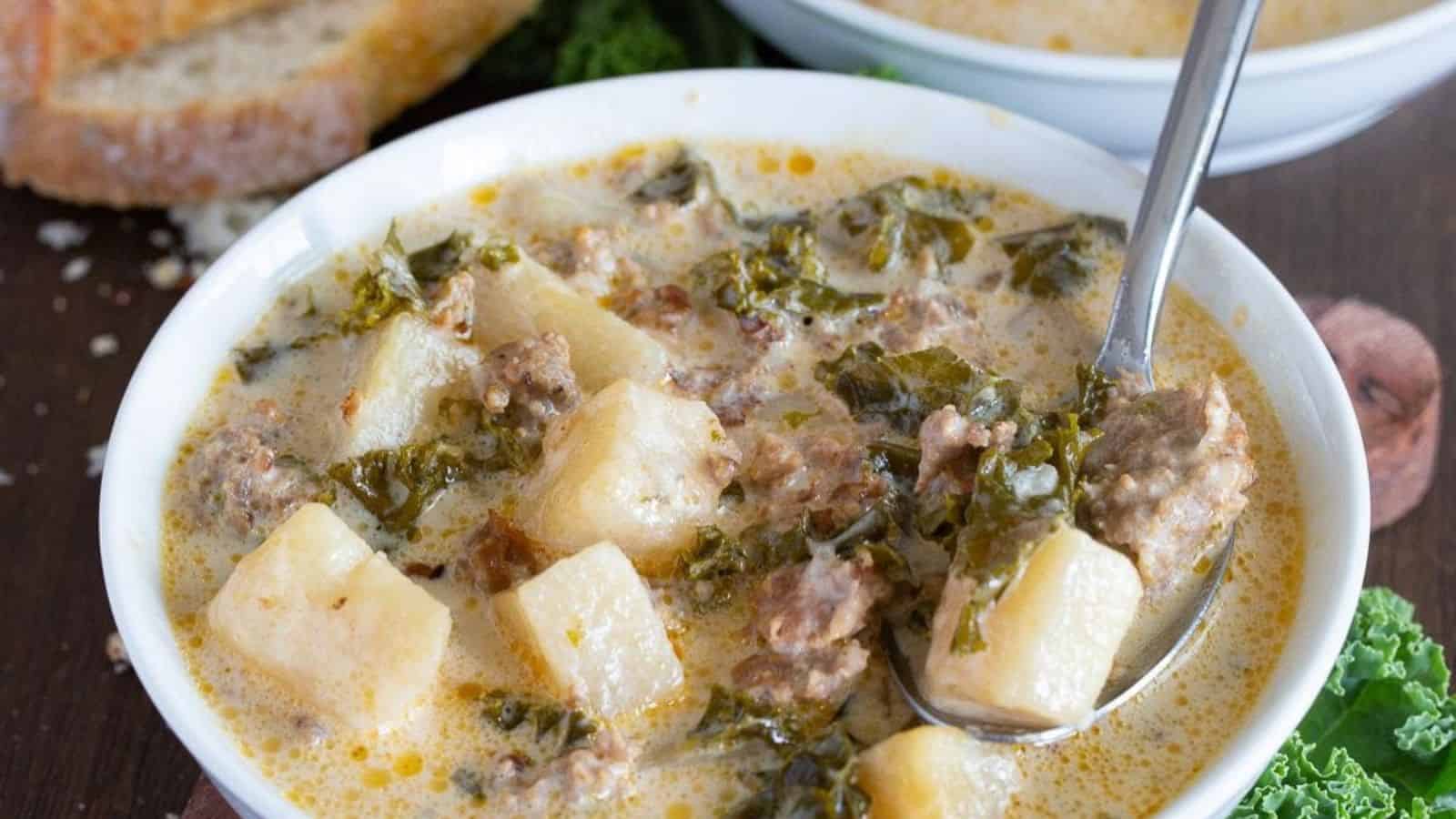 zuppa soup with potatoes and sausage in a bowl ready to serve.