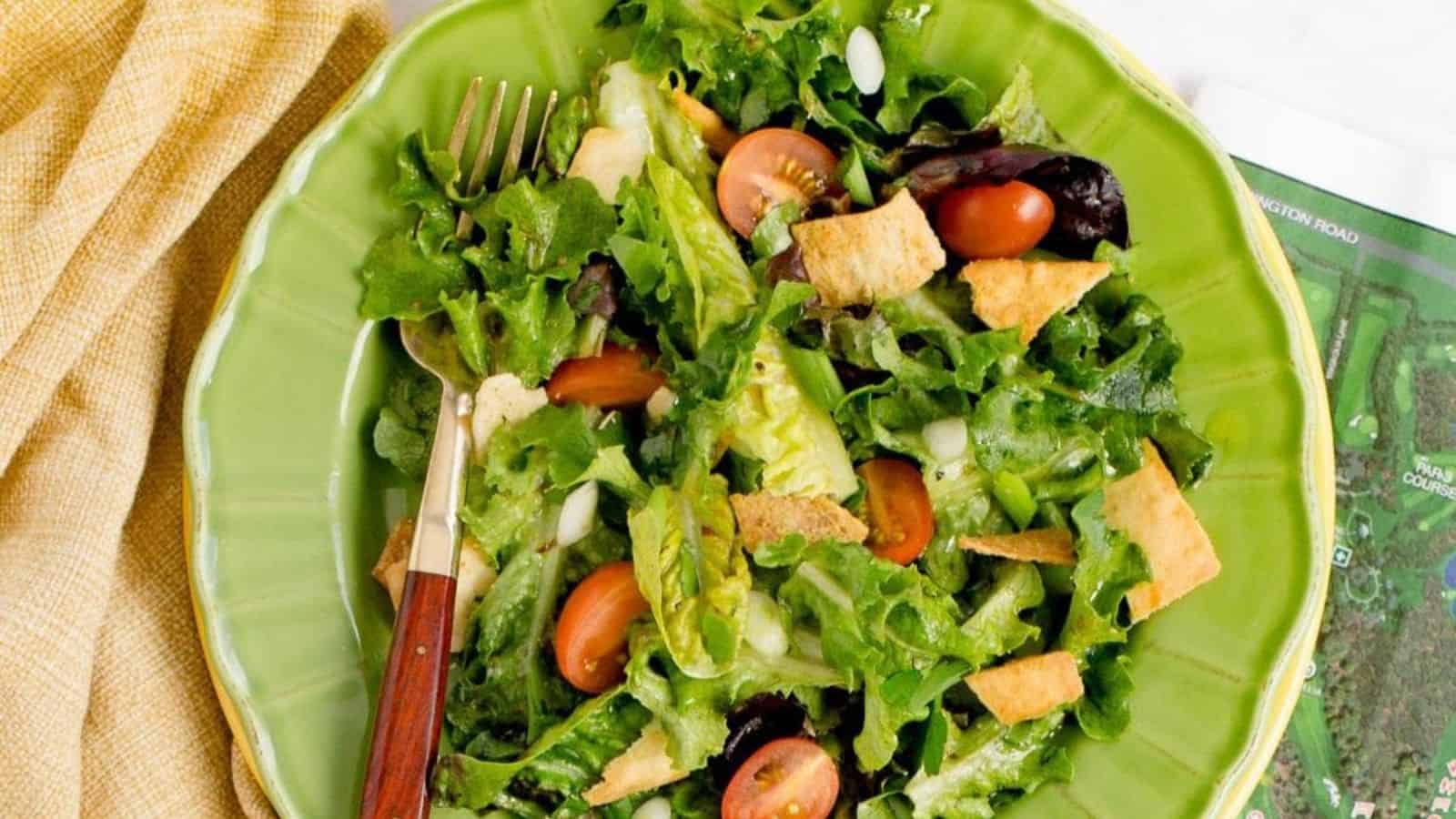 A fresh green jacket salad with a variety of vegetables and a light dressing.