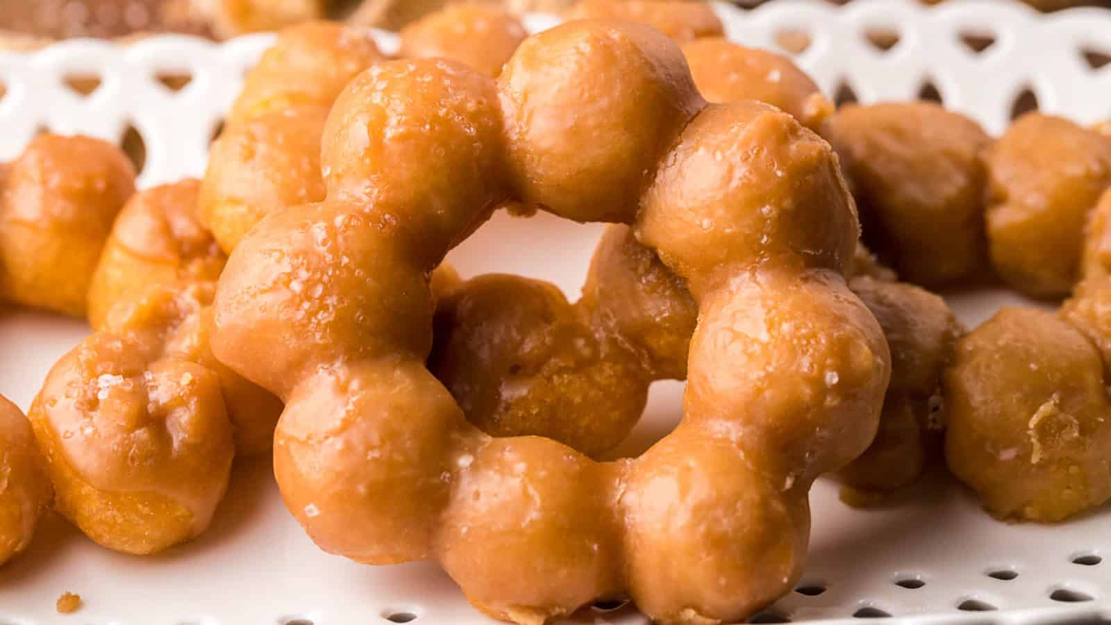 A close-up of a mochi donuts with brown butter glaze.